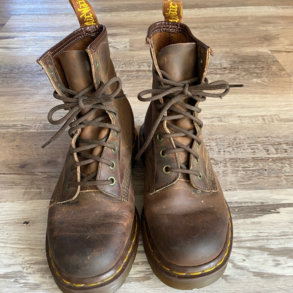 Brown Dr. Marten combat boots.